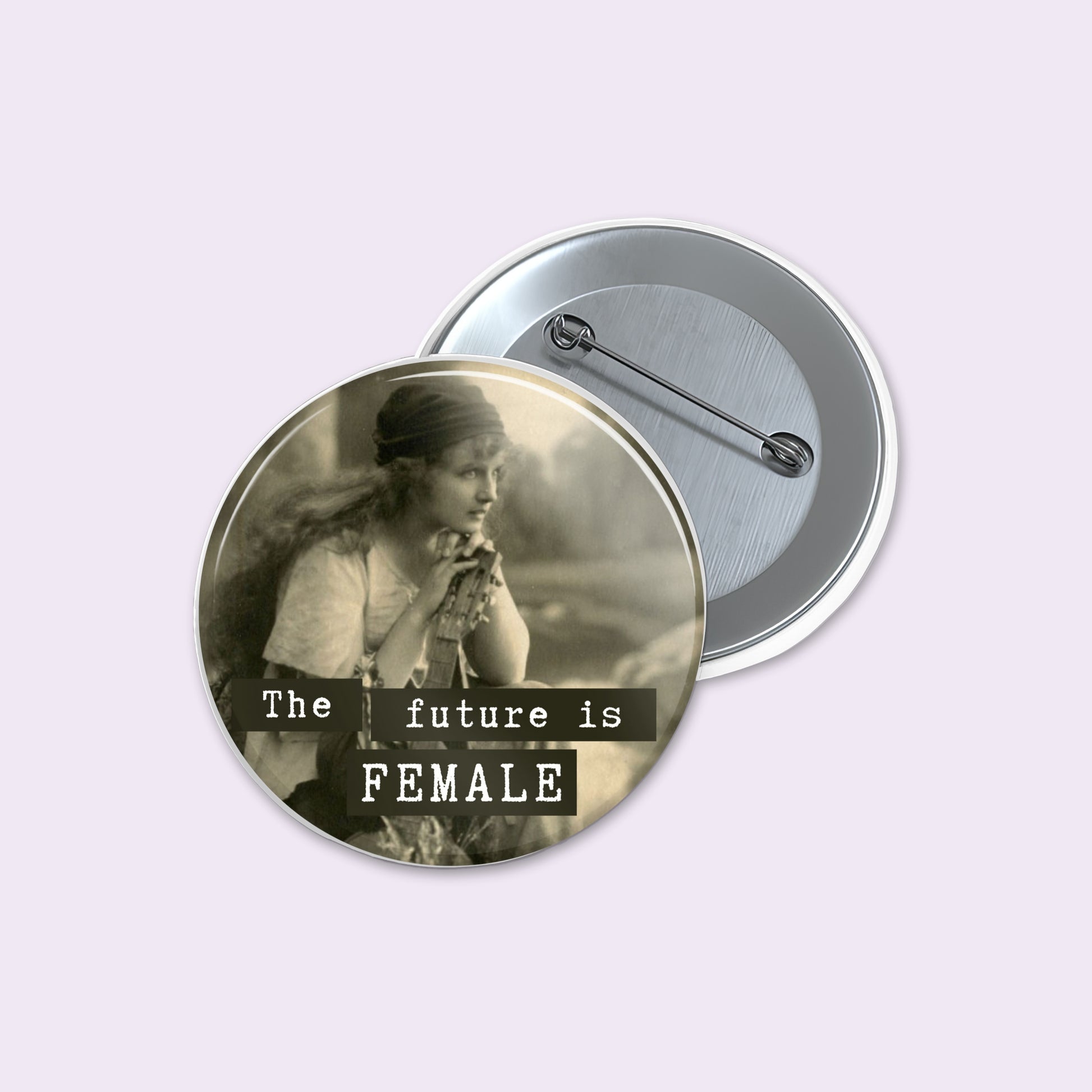 Round pinback button displays a sepia-toned vintage photograph of a woman with the text 'The future is FEMALE' in white lettering.