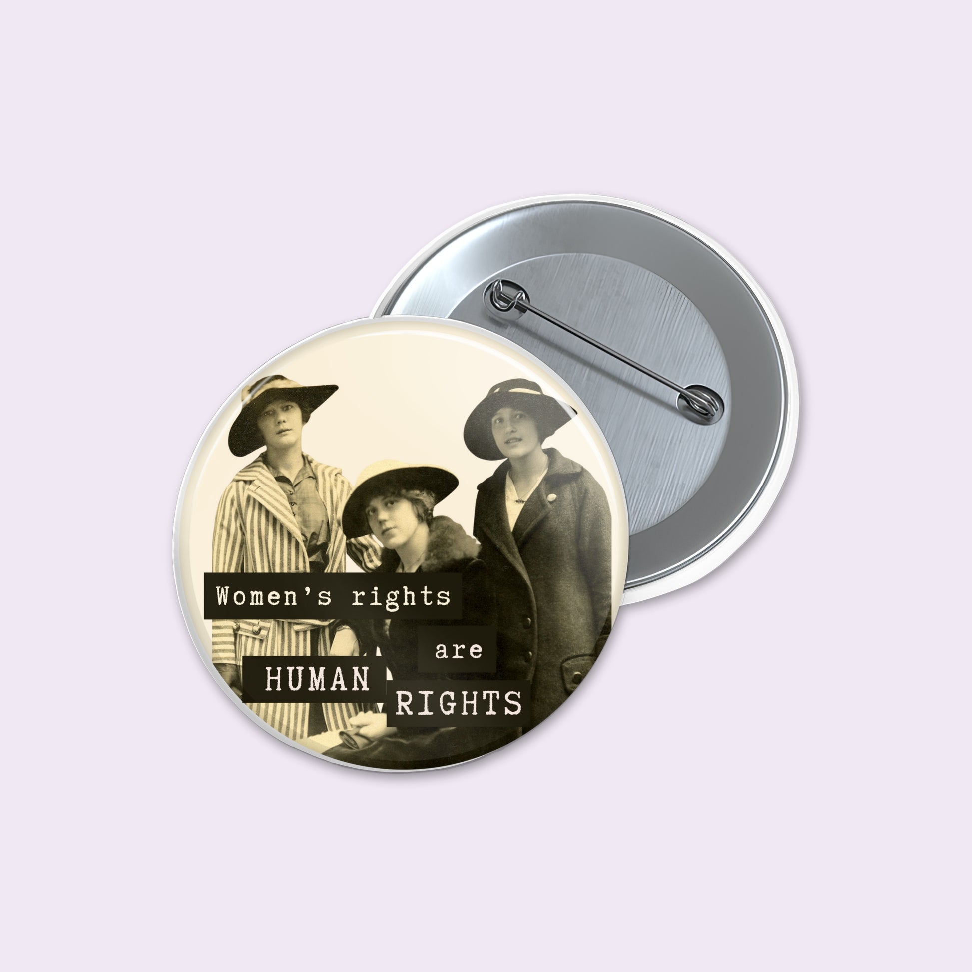 Round pinback button displays a vintage-style sepia photograph of three women with the text 'Women's rights are HUMAN RIGHTS' in black and white.