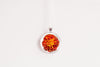 Glass cabochon pendant with orange marigold flower - Whimsy Spirit Shop
