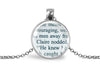Silver-toned pendant with upcycled book page text on a white background