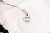 Necklace with upcycled book page pendant displaying text  on a white background