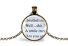 Necklace with upcycled book page pendant featuring text on a white background