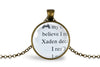 Necklace with pendant featuring upcycled book page text on a white background