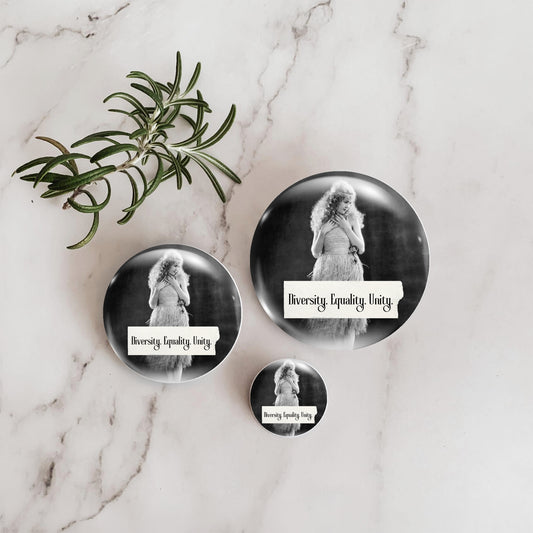 Retro woman on a pin back button with writing "Diversity. Equality. Unity." shown in three sizes