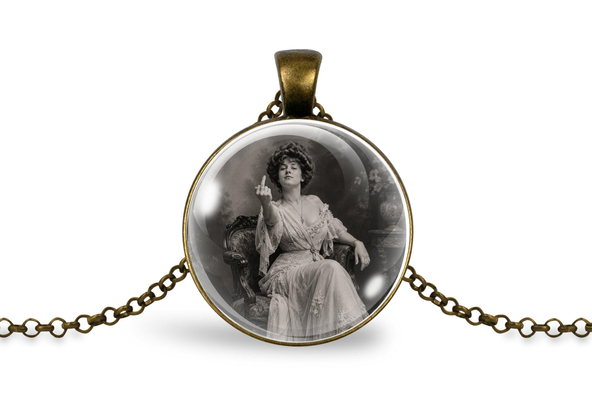 An antique style bronze-plated round pendant necklace featuring a vintage black and white photograph of a seated woman, suspended from a matching antique bronze chain on a white background.