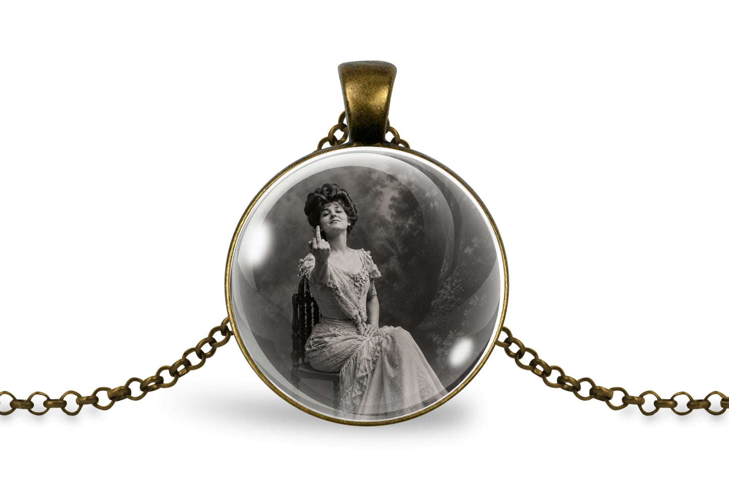 An antique bronze pendant necklace featuring a circular cabochon with a black and white vintage portrait of a seated woman, displayed on a clean white background.