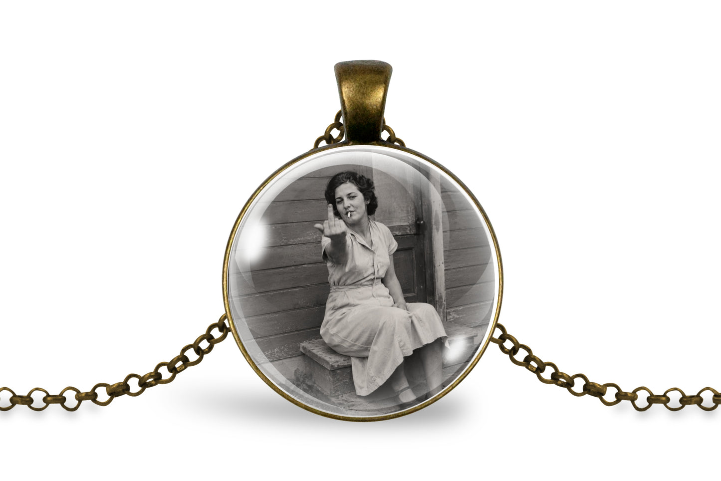 An antique bronze oval pendant necklace featuring a black and white vintage photograph of a woman sitting on a porch, displayed on a clean white background.