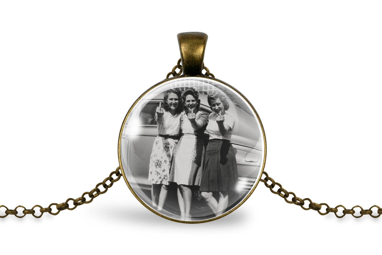 An bronze round pendant necklace featuring a black and white vintage photograph of three women holding up their middle fingers, displayed on a clean white background with its chain extending to both sides.
