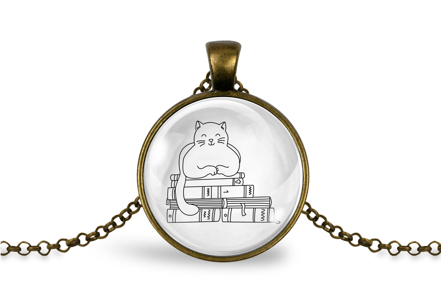 Glass cabochon pendant featuring a black line drawing of a cat sitting on stacked books