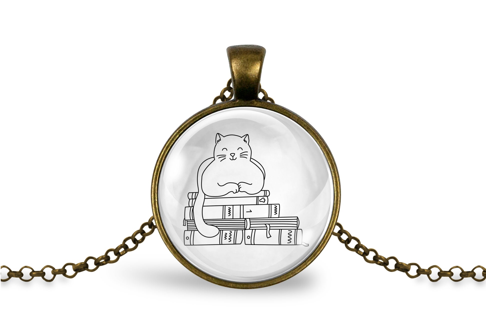 Glass cabochon pendant featuring a black line drawing of a cat sitting on stacked books