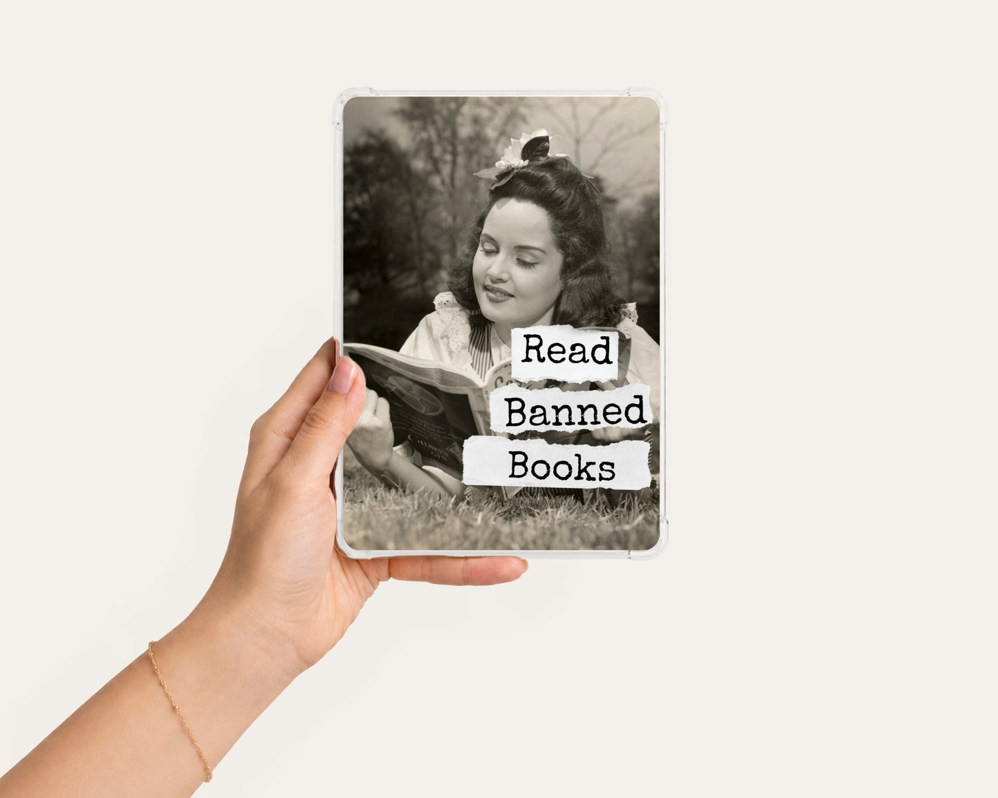 Read Banned Books printable Kindle clear case insert featuring a vintage woman reading outdoors with a curious bird perched above her, shown in a clean hand-held mockup on a light background.