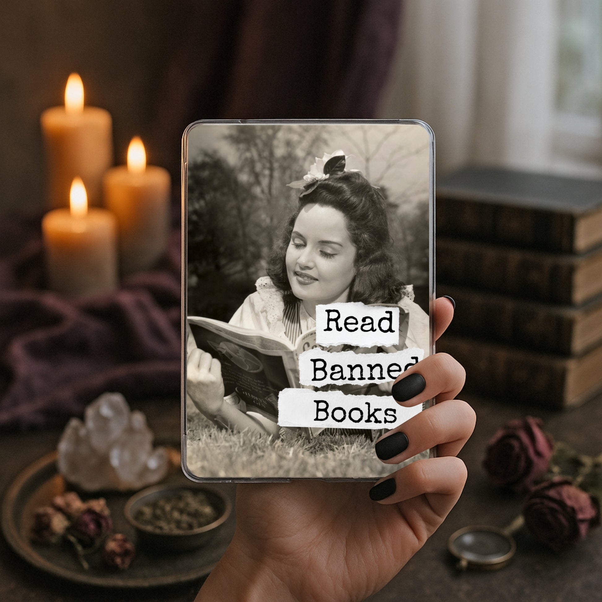 Read Banned Books printable Kindle clear case insert featuring a vintage woman reading outdoors with a curious bird perched above her, shown in a moody book-and-candle mockup.