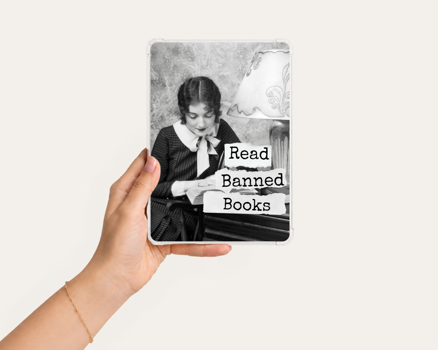 Read Banned Books printable Kindle clear case insert featuring a vintage young woman absorbed in her book, shown in a clean hand-held mockup on a light background.