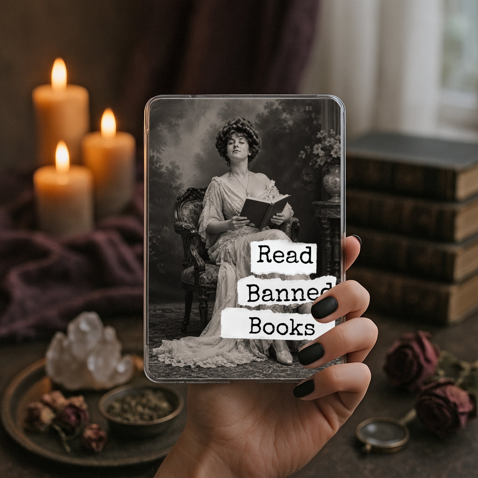Read Banned Books printable Kindle clear case insert featuring an elegantly dressed Victorian woman seated with a book, shown in a moody book-and-candle mockup.