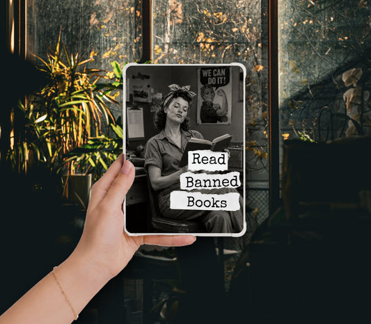 Read Banned Books printable Kindle clear case insert featuring Rosie the Riveter taking a well-earned reading break, shown in a clear Kindle case held against a dark botanical background.