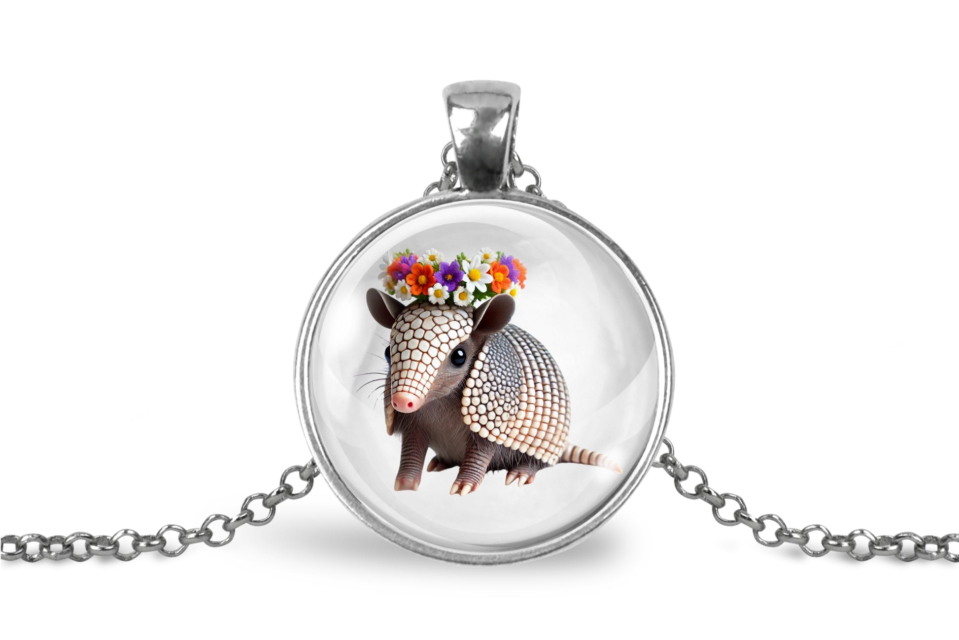 Necklace with pendant featuring an armadillo wearing a flower crown on a white background