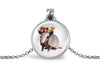 Necklace with pendant featuring an armadillo wearing a flower crown on a white background