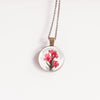 Gladiolus August birth flower necklace, bronze-plated glass cabochon pendant on chain