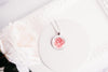 Rose necklace June birth flower on white plate with pink rose styling – silver-tone pendant