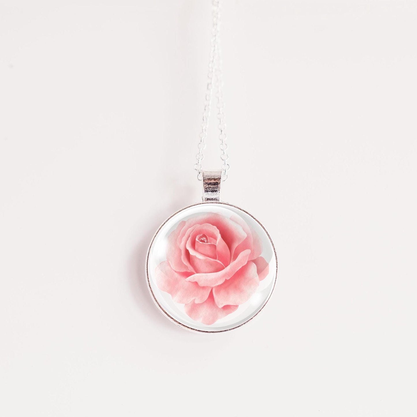 Rose birth flower necklace – pink rose glass cabochon pendant on silver-tone chain, white background