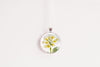 February birth flower necklace featuring yellow primrose in a silver -plated setting - Whimsy Spirit Shop