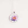 Water lily birth flower necklace – pink water lily glass cabochon pendant on silver-tone chain, white background