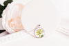 February birth flower necklace featuring yellow primrose in a silver -plated setting - Whimsy Spirit Shop