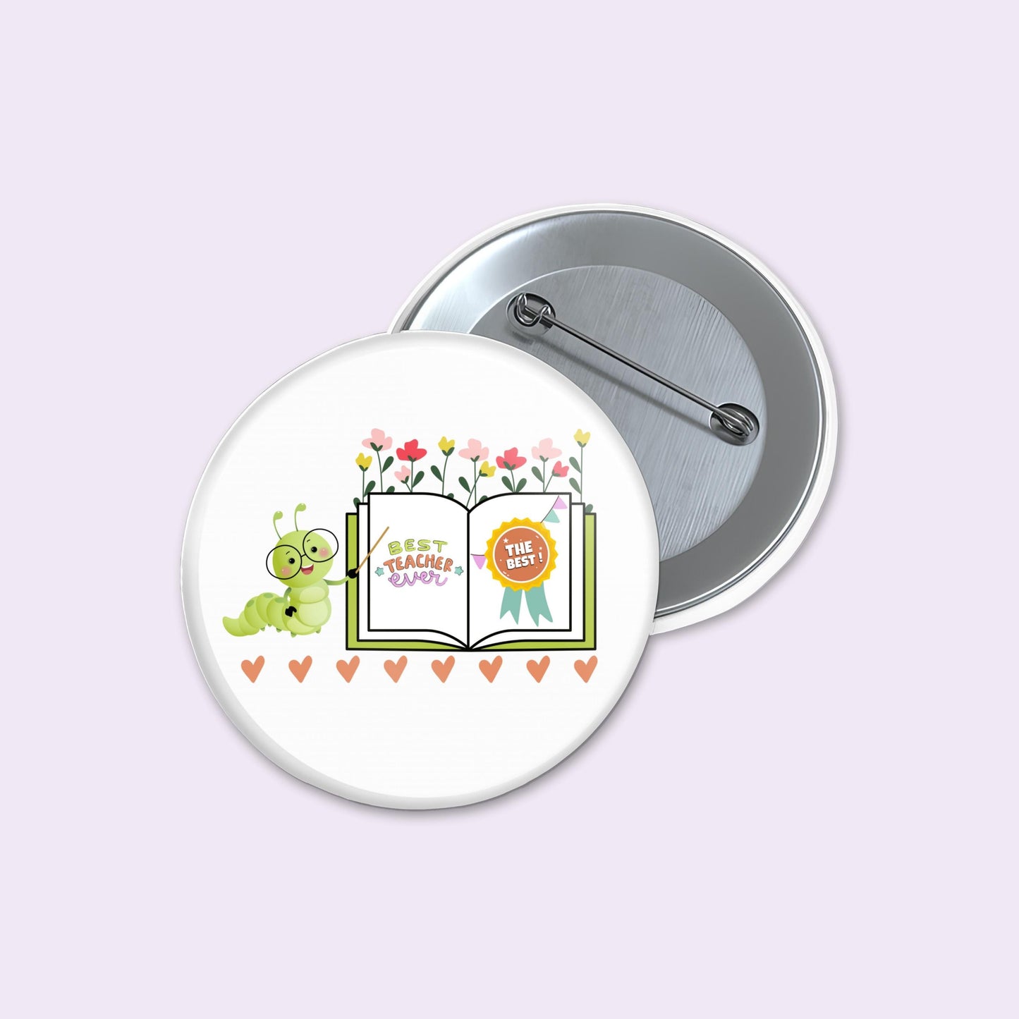 Button badge with a cartoon caterpillar and book design on a light purple background
