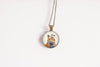 Necklace with a pendant featuring a fox design on a white background