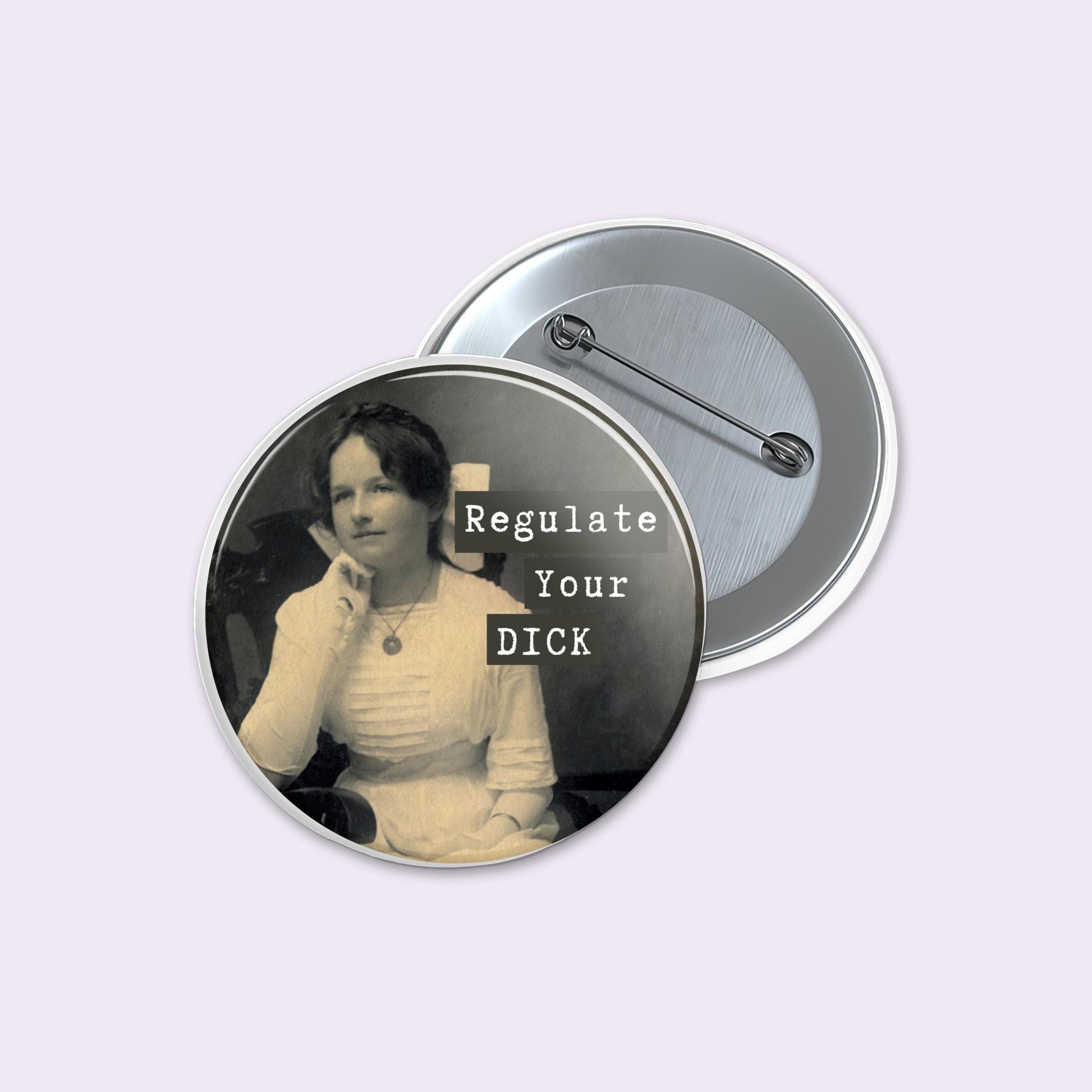 Button badge with a vintage-style portrait and text 'Regulate Your DICK' on a light purple background.