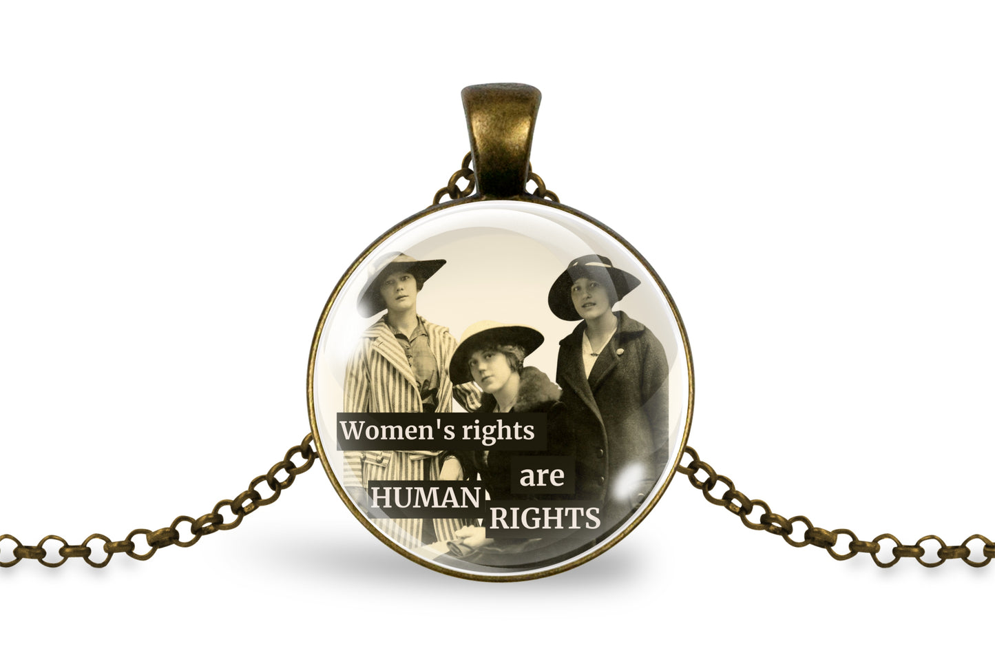 An antique-inspired bronze pendant necklace featuring a vintage sepia-toned photograph of three women with the text 'Women's rights are HUMAN RIGHTS' printed across the bottom, displayed on a clean white background.