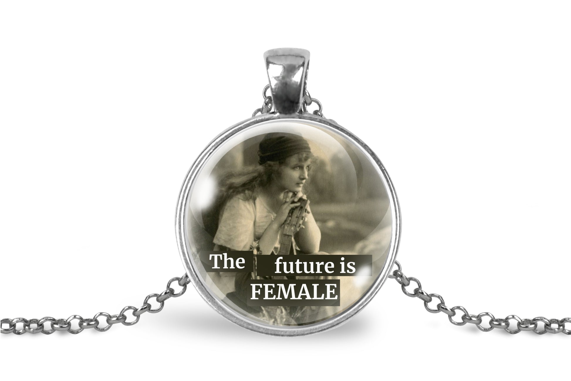 A silver pendant necklace featuring a vintage-style circular glass cabochon with a sepia-toned image of a woman and the text 'The future is FEMALE', displayed on a clean white background.