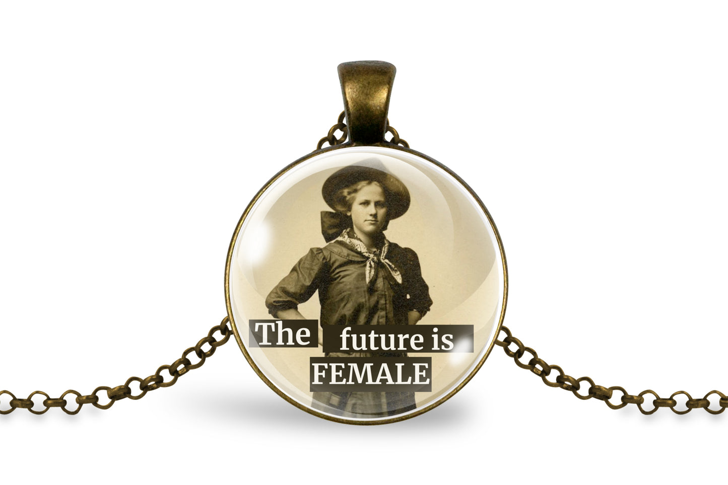 An antique bronze pendant necklace featuring a circular cabochon with a vintage sepia-toned portrait of a woman and the text 'The future is FEMALE' in white lettering, displayed on a clean white background.