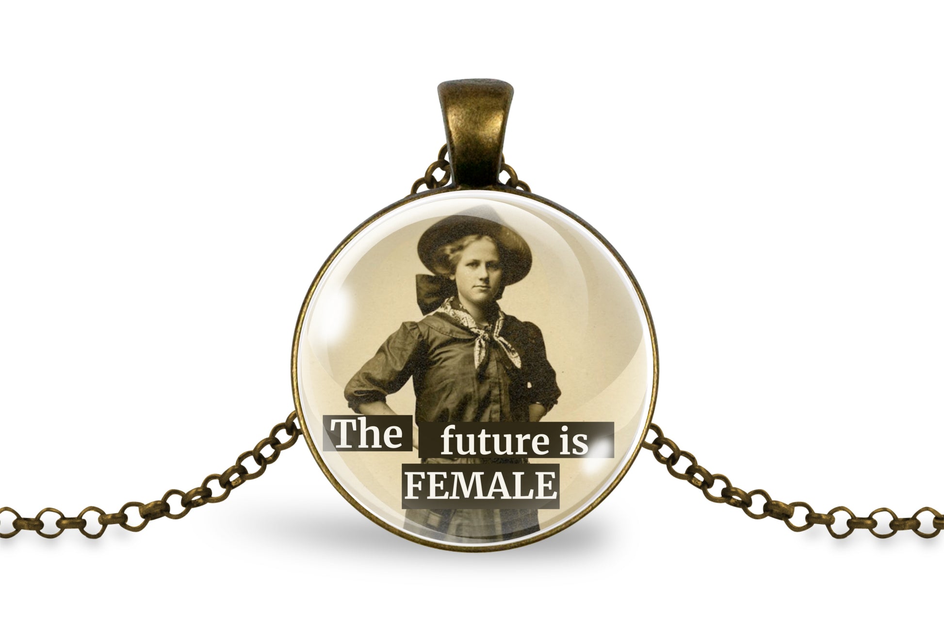 An antique bronze pendant necklace featuring a circular cabochon with a vintage sepia-toned portrait of a woman and the text 'The future is FEMALE' in white lettering, displayed on a clean white background.