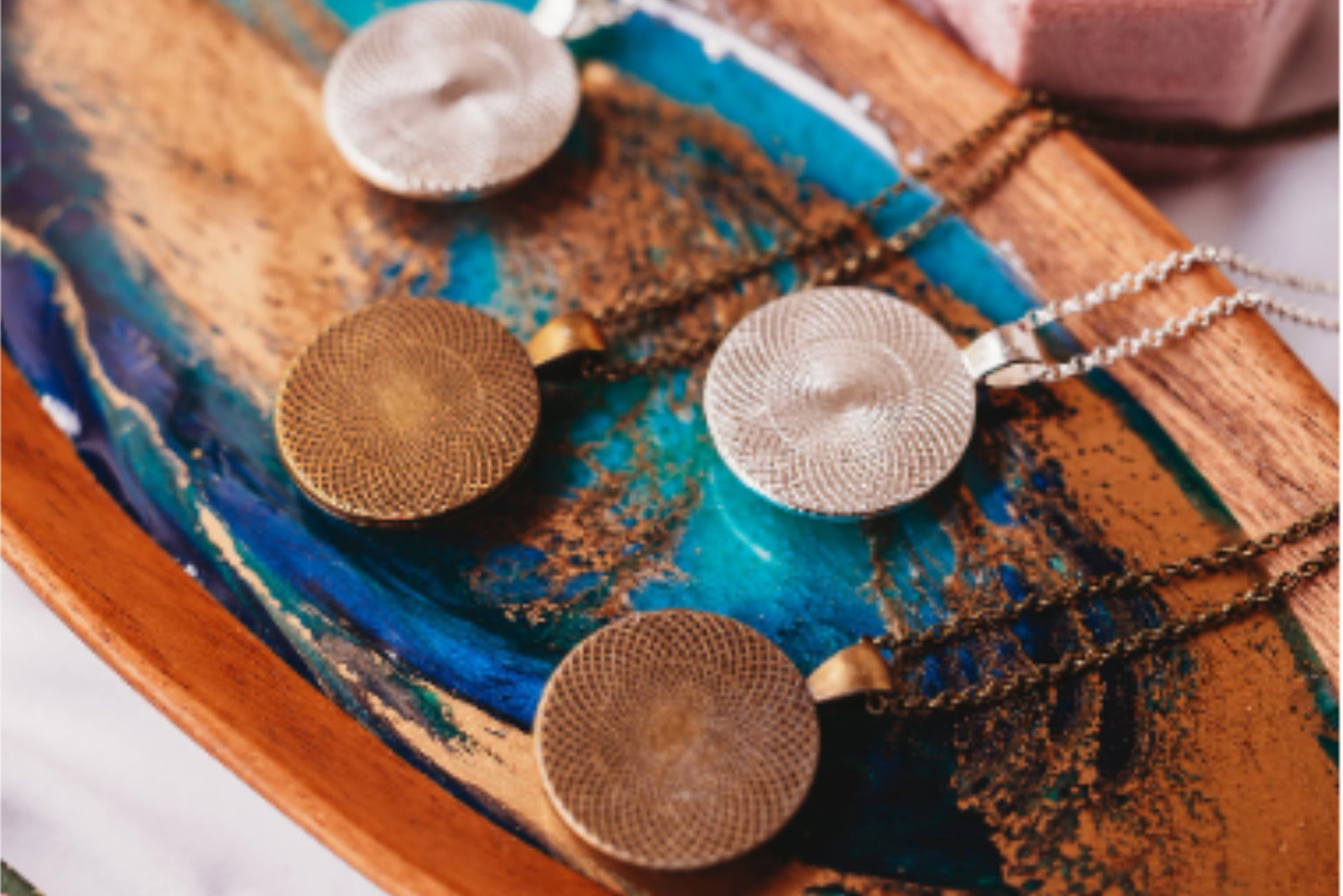 Back view of bronze-plated and silver-toned pendant necklaces