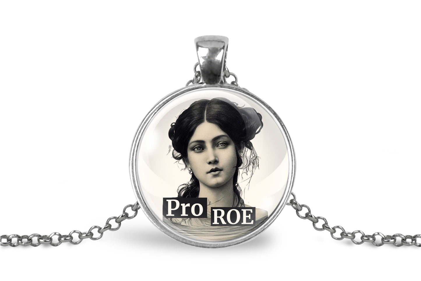 A silver-toned round pendant necklace on a white background, featuring a vintage-style black and white portrait of a woman with the text 'PRO ROE' overlaid at the bottom.