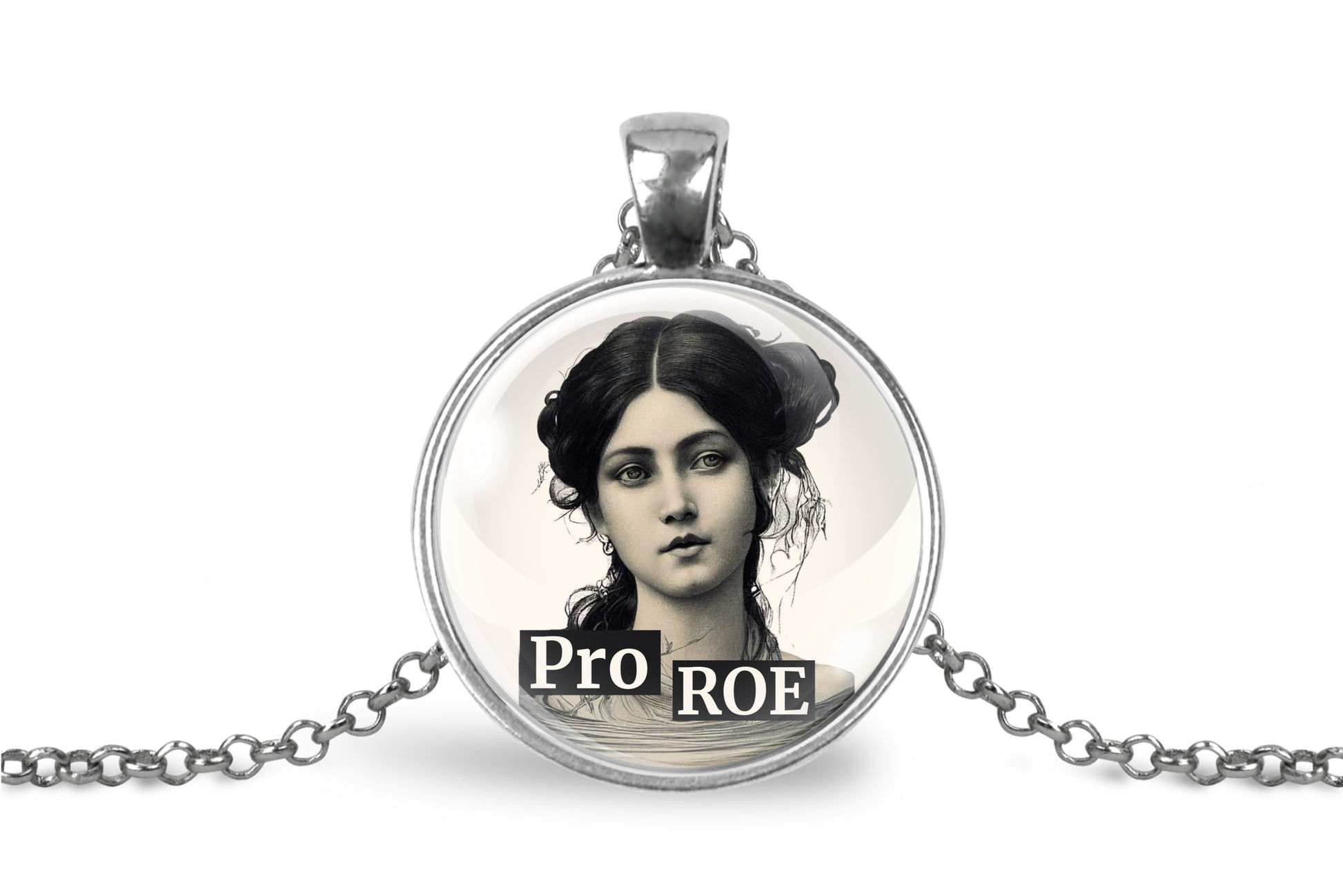 A silver-toned round pendant necklace on a white background, featuring a vintage-style black and white portrait of a woman with the text 'PRO ROE' overlaid at the bottom.