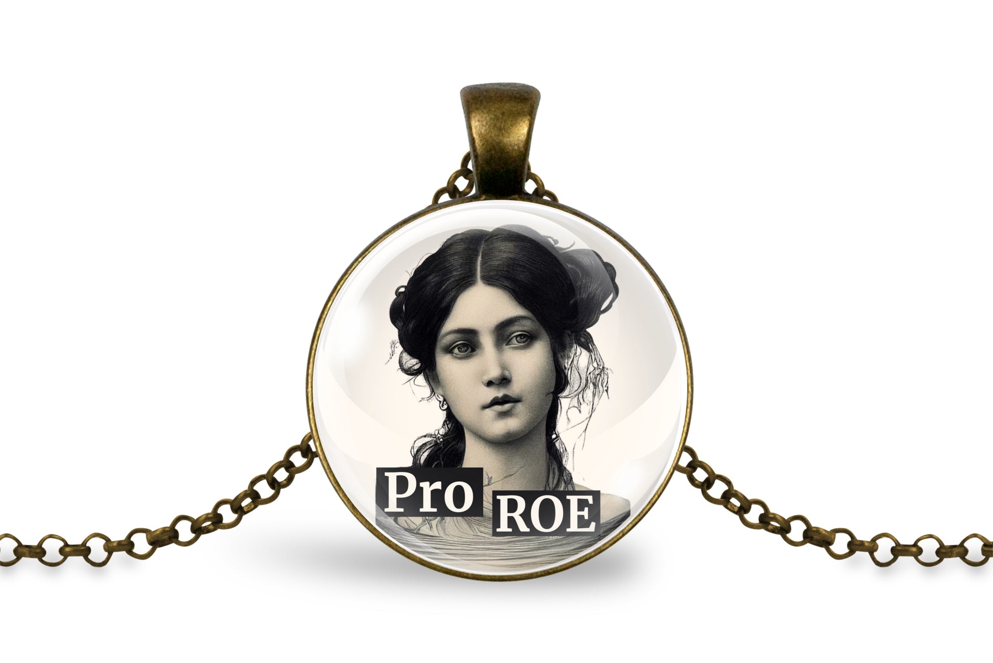 A round pendant necklace with an antique bronze-colored metal bezel and chain, featuring a black and white portrait of a woman and the text 'Pro ROE' printed on the bottom of the pendant.