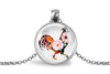 Necklace with a round pendant featuring a colorful rooster design on a white background