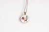 Necklace with a round pendant featuring a rooster design on a white background