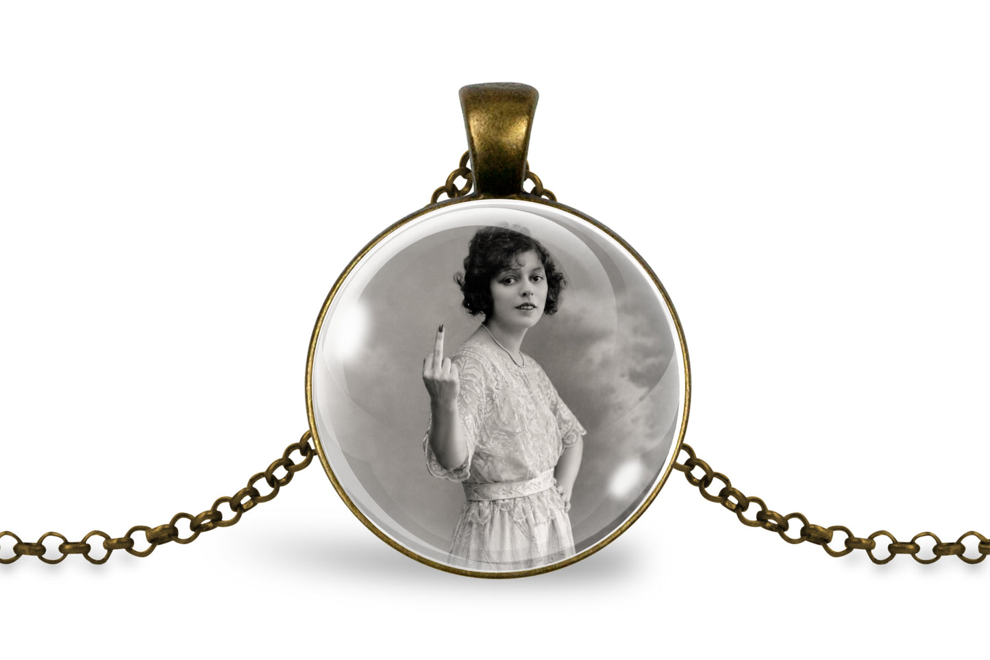 An antique bronze round pendant necklace featuring a black and white vintage portrait of a woman holding up her middle finger, displayed on a clean white background.