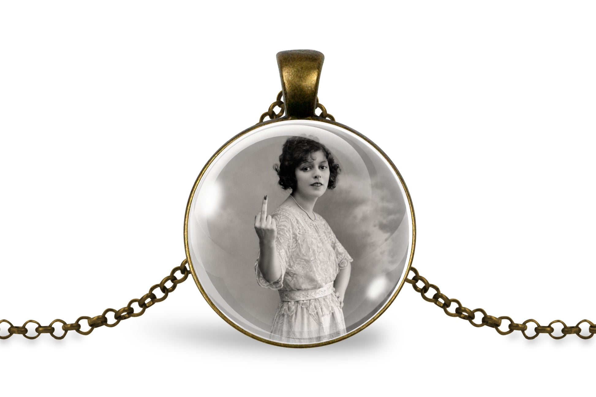 An antique bronze round pendant necklace featuring a black and white vintage portrait of a woman holding up her middle finger, displayed on a clean white background.